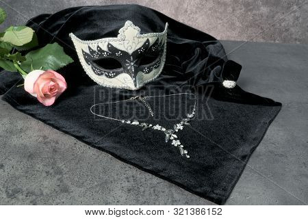 Photo Of Elegant White And Black Venetian, Carnaval Mask Over Dark Background. Vintage Photo