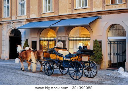 Horse Fiaker On Street With Snow In Salzburg Of Austria