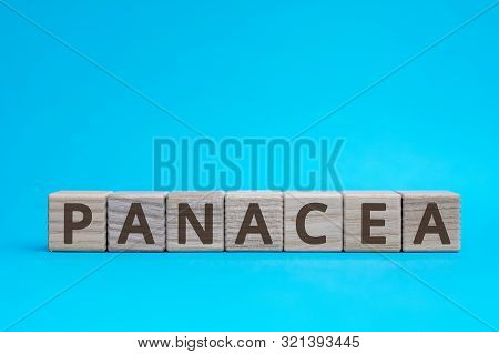 Panacea Inscription Wooden Cubes With Letters On A Blue Background
