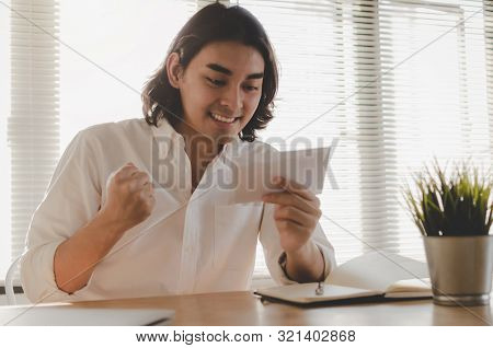 Happy Young Asian Employee Business Man Holding Money Bonus Card In Paper Envelope To Increasing Of 