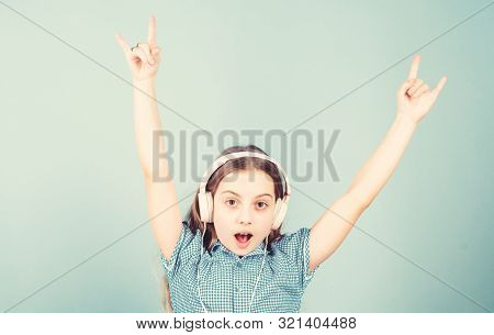 Shes A Rock Star. Little Kid Showing Horn Hand Gesture Like A Hard Rock Or Heavy Metal Fan. Cute Sma
