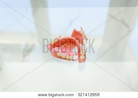 Large Image Of A Modern Denture Nylone On A Glass Background