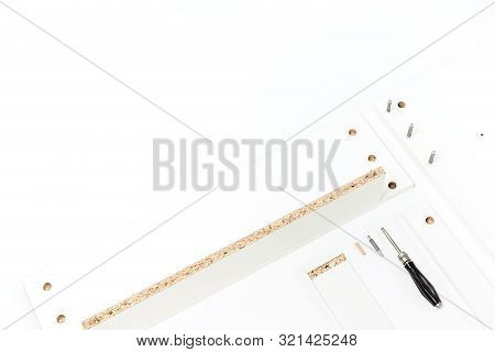 Tools For Assembly Of Flat Packed Furniture On White Background. White Diy Funiture Parts With A Scr