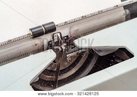 Carriage With Letters In A Mechanical Typewriter. Letter Pressed
