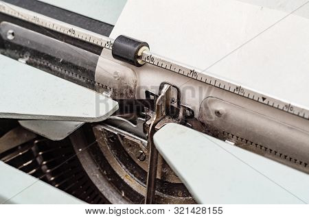 Carriage With Letters In A Mechanical Typewriter. Letter Pressed