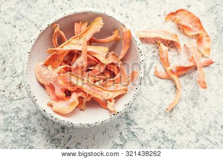 Healthy Homemade Vegetable Chips From Carrot With Salt, Pepper And Origano On Black Background. Orga