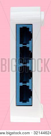 White 8 Port Plastic Ethernet Switch Isolated On Pink Background At Dry Day