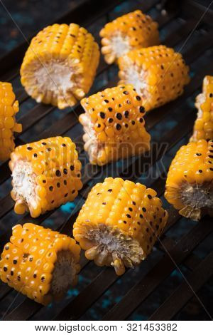 Sweet corn slices grilled and spiced as healthy party food alternative