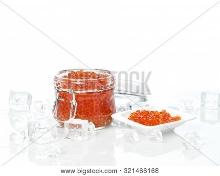 Salmon Or Keta Red Caviar In Jar Can And Little Plate With Ice On Table. Sea Food. Healthy Eating