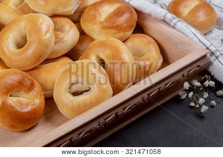 Plane Mini Bagels In Wooden Tray With Flowers.
