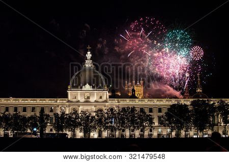 Lyon, France - July 14, 2019: Fireworks Bursting Over Hotel Dieu In Lyon For French National Holiday