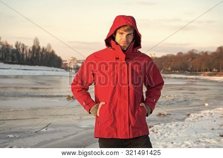 Hipster Winter Warm Outfit. Guy Wear Jacket With Hood On Frosty Winter Day. Man Bearded Stand Warm J