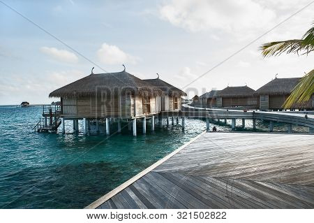 Water Villas In The Maldives In The Sun