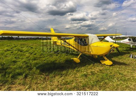 KALININGRAD, Russia - August 18, 2019: 100 Anniversary First European Airport Devau Fest, Ultra Light Propeller Screw Plane Ready for Flight