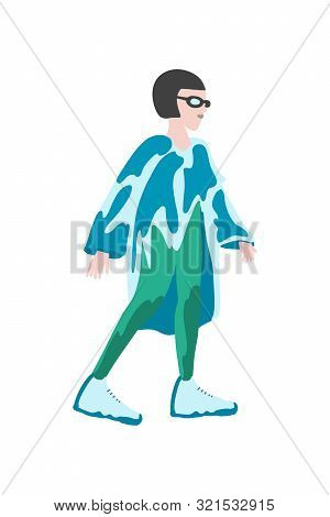 Model Posing. Beautiful Young Woman In Poncho And Fashionable Sneakers. Exclusive Print Clothes. . H