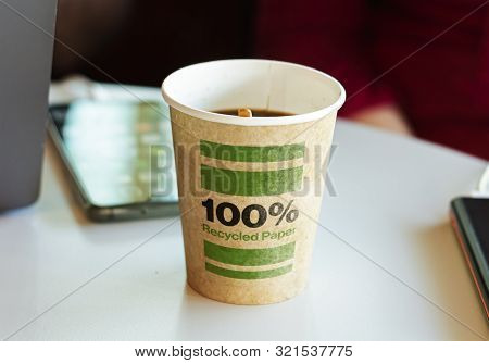 A Recycled Paper Container Containing Hot Coffee For A Break. Environmental Protection And Ecologica