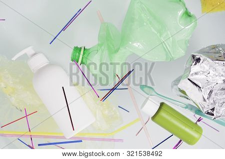 Plastic Trash Floats On The Surface Of The Water In The Bathtub. The Concept Of Environmental Pollut