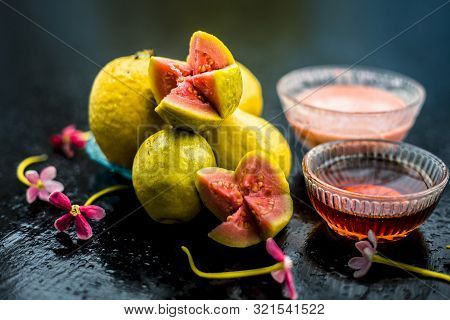Skin Whitening Remedy/treatment On The Black Shiny Surface Consisting Of Guava Pulp And Honey. Also