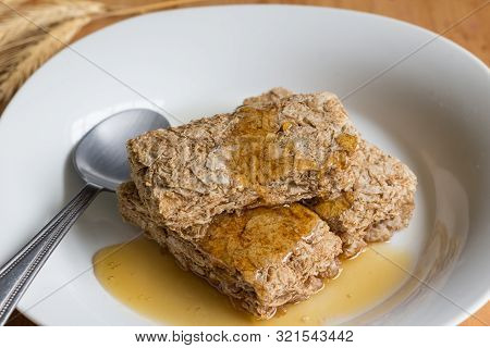 Breakfast Wheat Cereal Bars Coated With Honey In White Bowl Close Up