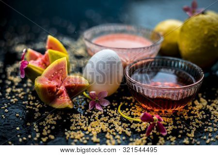 Guava Face Mask For Dry Skin On A Wooden Surface With Vivid Colors I.e., Guava Pulp, Egg Yolk, Oatme