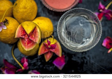Guava Face Mask For Glowing Skin On A Wooden Surface With A Blurred Background Consisting Of Some Gu