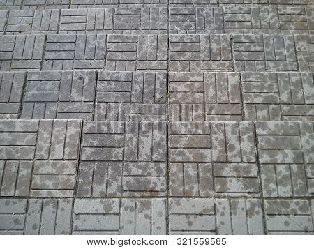 Traces Of Raindrops On Steps From Gray Recycled Tiles