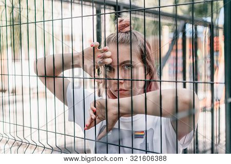 Outdoor Portrait Of Young Teenager Hipster Girl With Pink Hair And Lgbt Sign. Lgbtq Youth, Lgbt Gay 