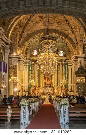 Manila, Philippines - March 5, 2019: San Augustin Church. Shot From Entrance: Hall Under Bowing Ceil
