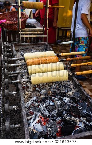 Preparation Of The Famous, Traditional And Delicious Hungarian Chimney Cake Kurtos Kolacs (kürtőskal