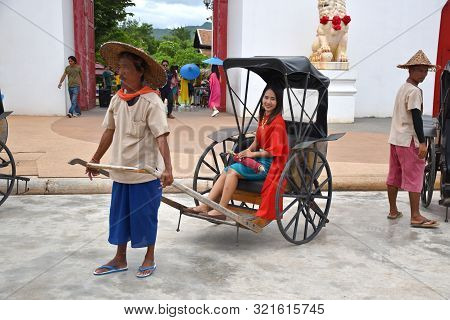 Kanchanaburi, Thailand, 09.09.2019: Beautiful Thai Girl In Traditional Thai, Siamese Dress In An Old