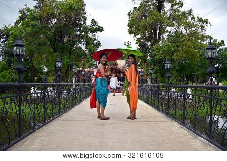 Kanchanaburi, Thailand, 09.09.2019: Beautiful Thai Girls In Traditional Thai, Siamese Dress With Gre