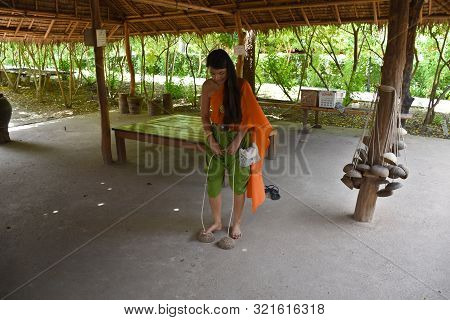 Kanchanaburi, Thailand, 09.09.2019: Beautiful Thai Girl In Traditional Thai, Siamese Dress With Gree