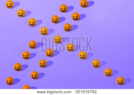 Halloween Orange And Violet Seamless Pattern. Orange Candle Pumpkins. Jack Olantern. Many Orange Pum