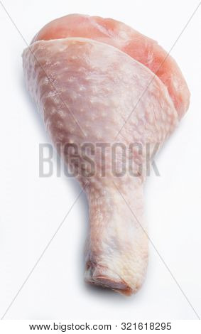 Raw chicken leg isolated on white background.