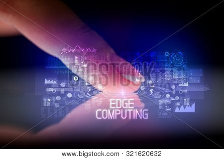 Finger touching tablet with web technology icons and EDGE COMPUTING inscription