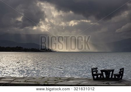 Empty Picnic Table In In The Norwegian Village Herand In Front Of A Dramatic Sky Over The Hardangerf