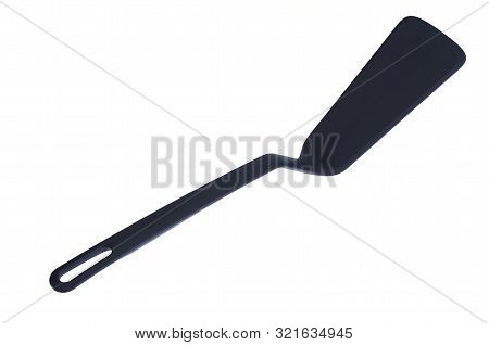 Plastic Kitchen Spatula For The Pan. Photo