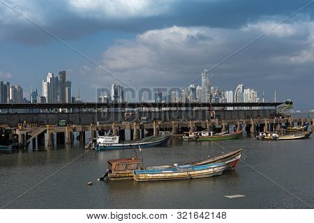 Panama City, Panama-march 04, 2019: Old Fishing Boats Near Fish Market In Panama City With Skyline B
