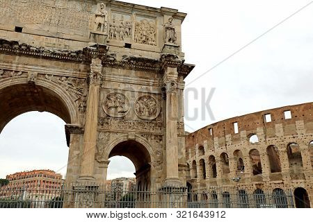 Arch Of Constantine And In The Background The Colosseo In The Archaeological Area Of The Imperial Fo