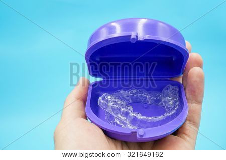 Clear Plastic Retainer Teeth In The Box Set Isolated On Blue Sky Background. It's An Equipment For O