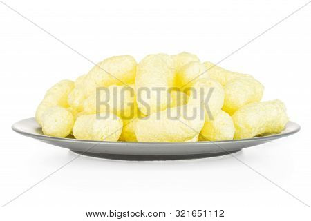 Lot Of Whole Salted Yellow Corn Puff On Gray Ceramic Plate Isolated On White Background