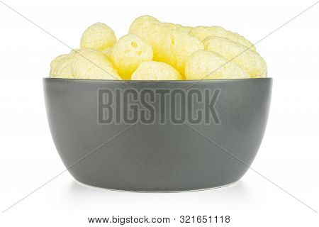 Lot Of Whole Salted Yellow Corn Puff In Gray Ceramic Bowl Isolated On White Background