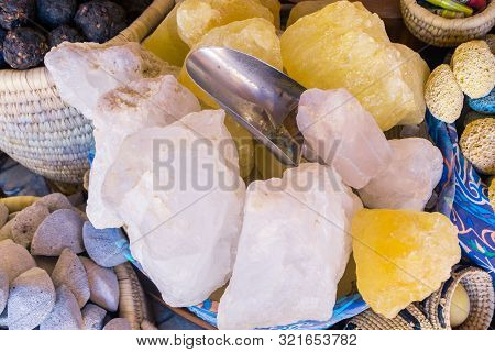 White Stones From Ocean In Wicker Basket