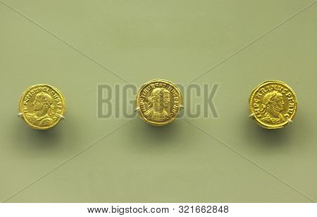 Merida, Spain - December 20th, 2017: 3 Gold Coins Of Carinus, Roman Emperor. National Museum Of Roma