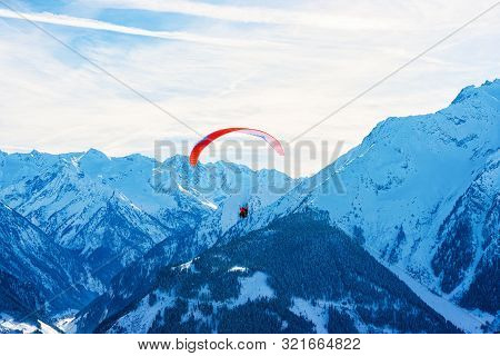 People Paragliding On Parachute In Sky Penken Park Austria