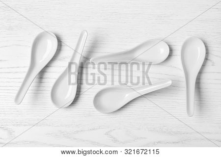 Flat Lay Composition With Miso Soup Spoons On White Wooden Table