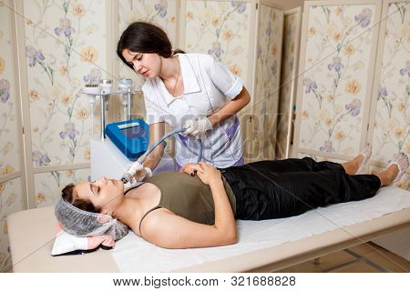 Lymphatic Drainage Massage Lpg Apparatus Process. Therapist Beautician Makes A Rejuvenating Facial M