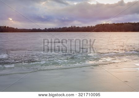 First Ice On The Lake In Late Autumn. Winter Coming Landscape