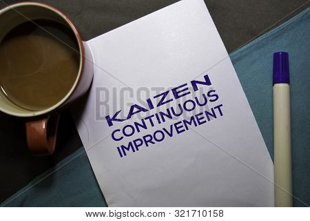 Kaizen. Continuouse Improvement Text On The Paper Isolated On Office Desk Background. Japanese Conce