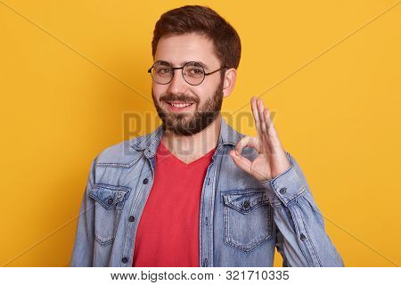 Man Wearing Stylich Clothes Making Ok Sign And Looking Smiling At Camera, Guy Dressed Denim Jacket A